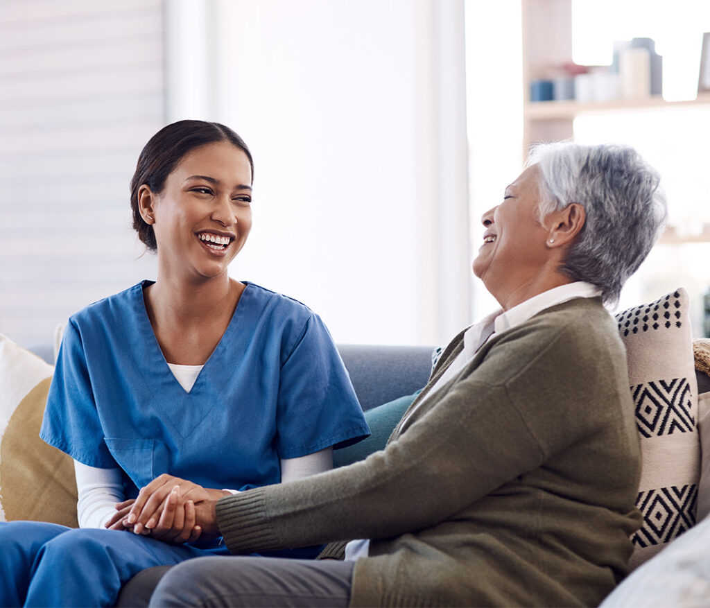 Staff interacting with residents in a senior living facility (professional, welcoming vibe).